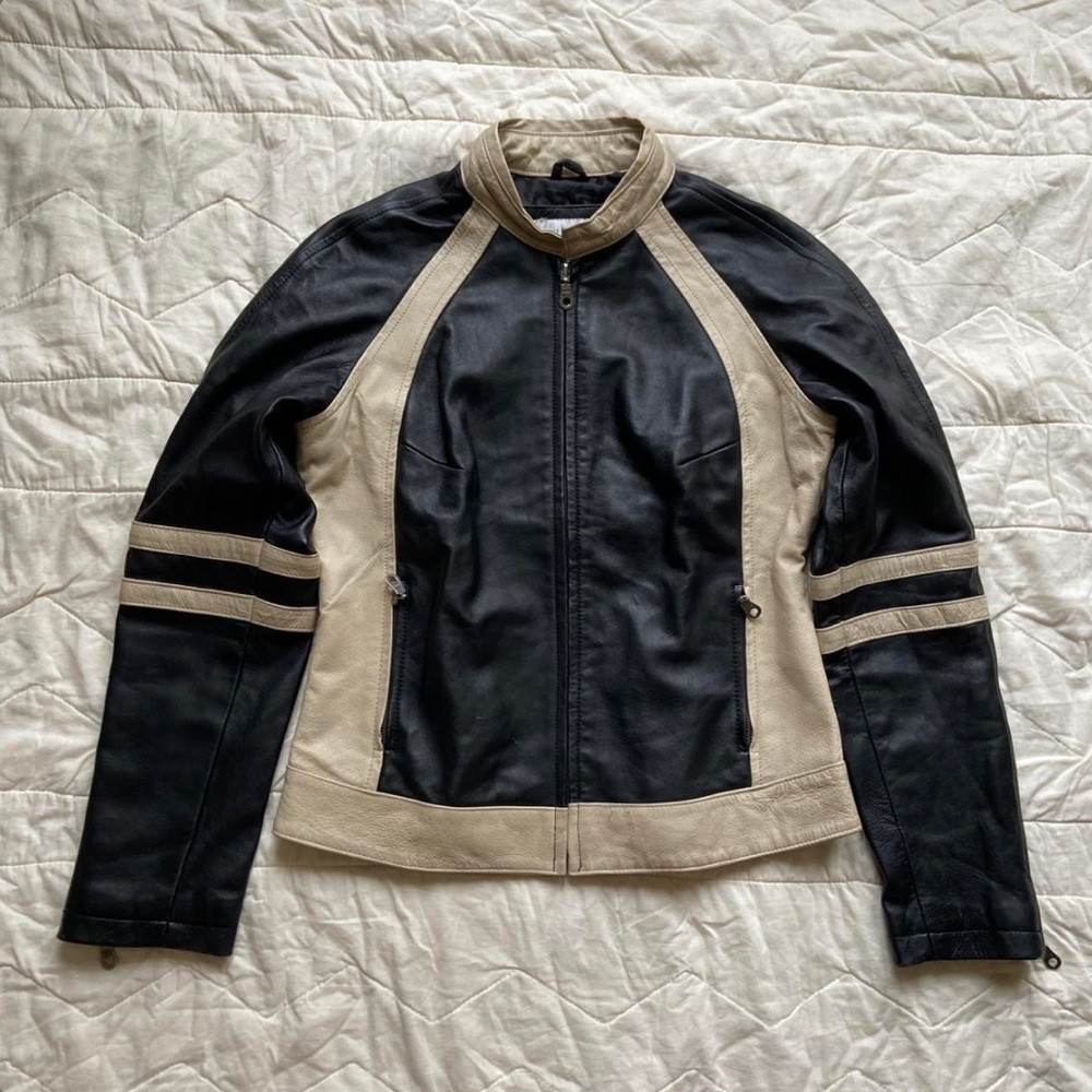 Wilson’s maxima cream and black leather jacket